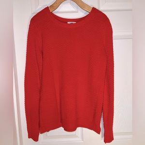 Reddish orange sweater